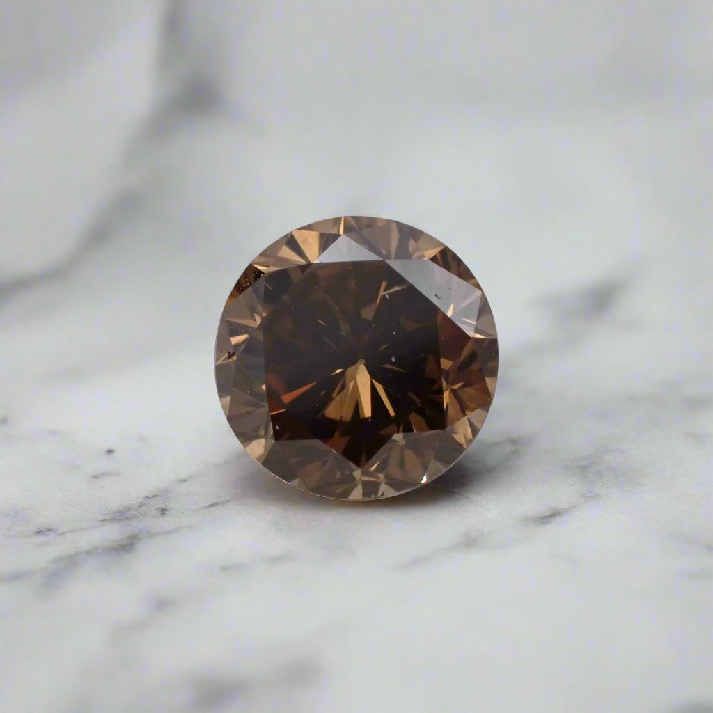 A rich, dark brown round diamond is shown up close with light reflecting in the facets.