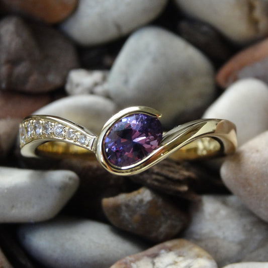 Purple sapphire and 18ct yellow gold bespoke curved engagement ring