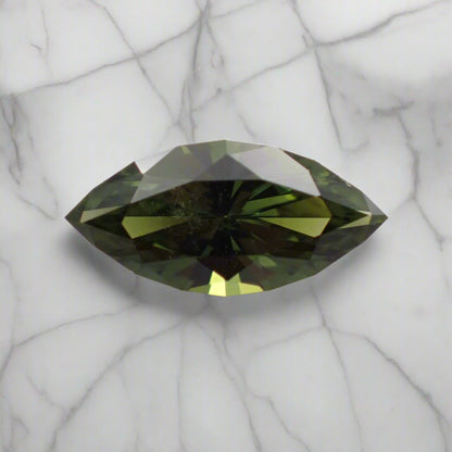 Green gemstone on a light gray background