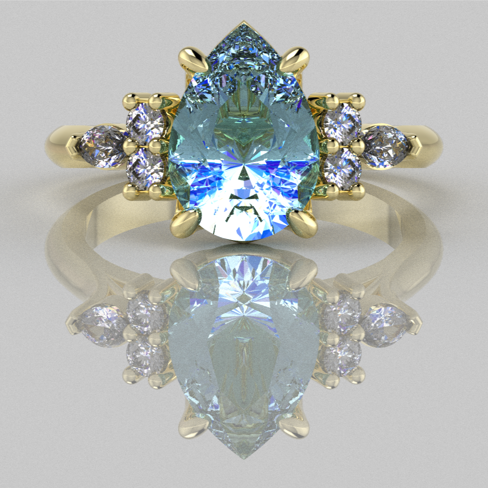 A computer render of a fantasy engagement ring set with one blue, pear shaped stone and six small diamonds.