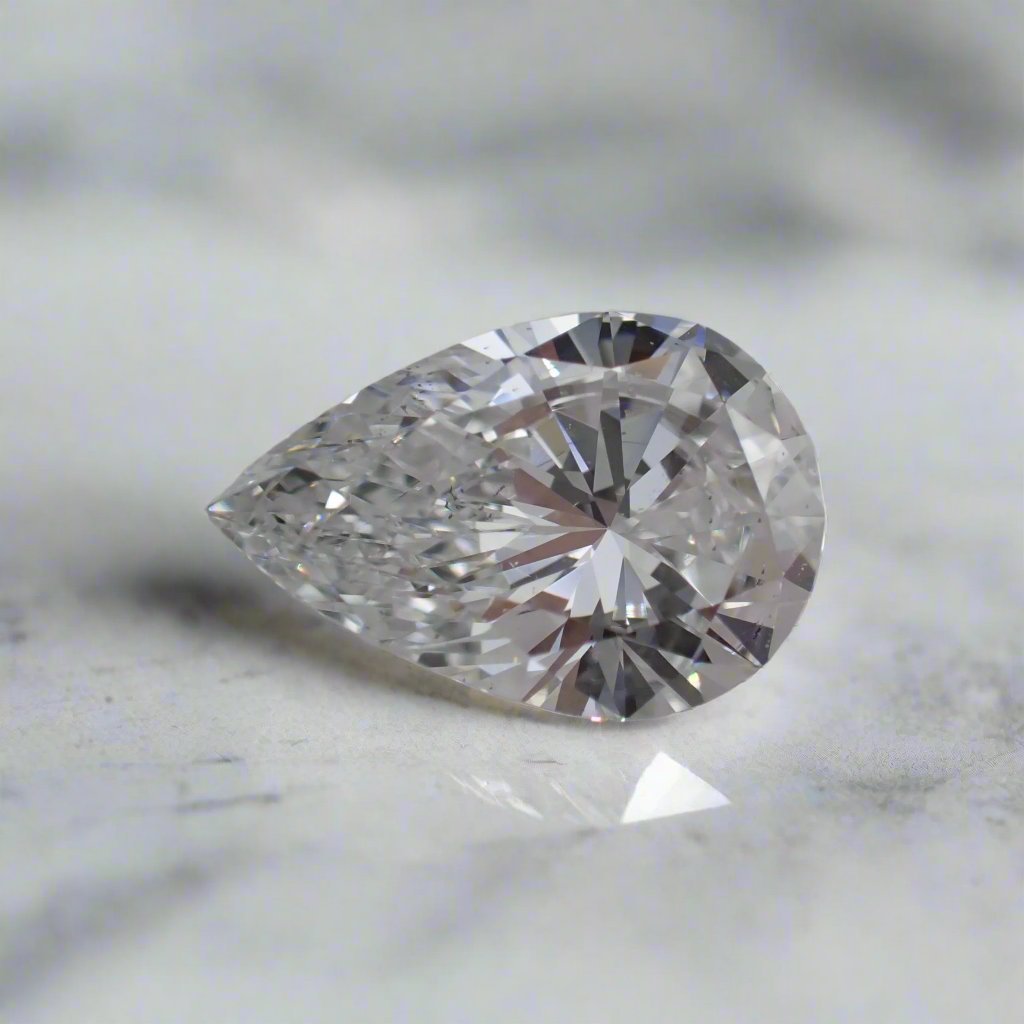 a zoomed in photo of a recycled, pear cut diamond with small inclusions