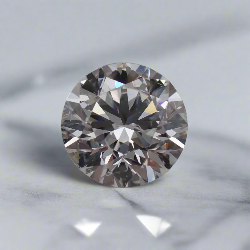 A round brilliant cut diamond with small feathery inclusions rests on a white surface.