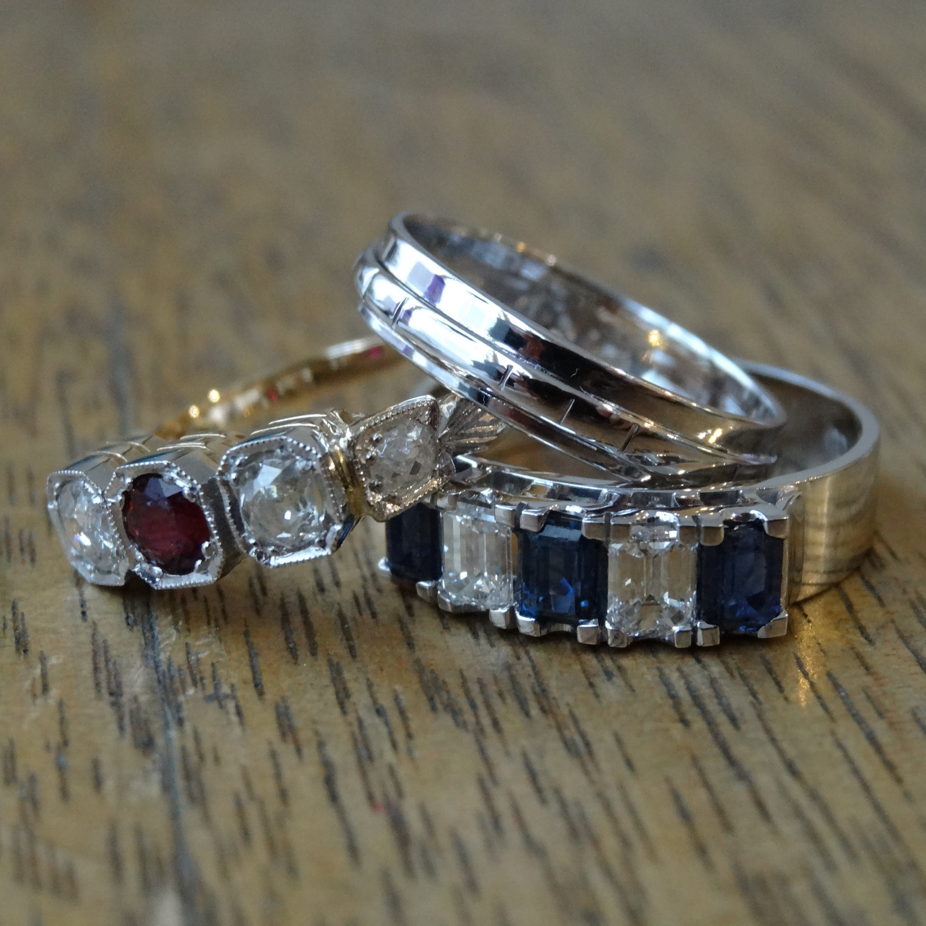 Sapphire, ruby and diamond rings that have been restored by an expert jeweller.