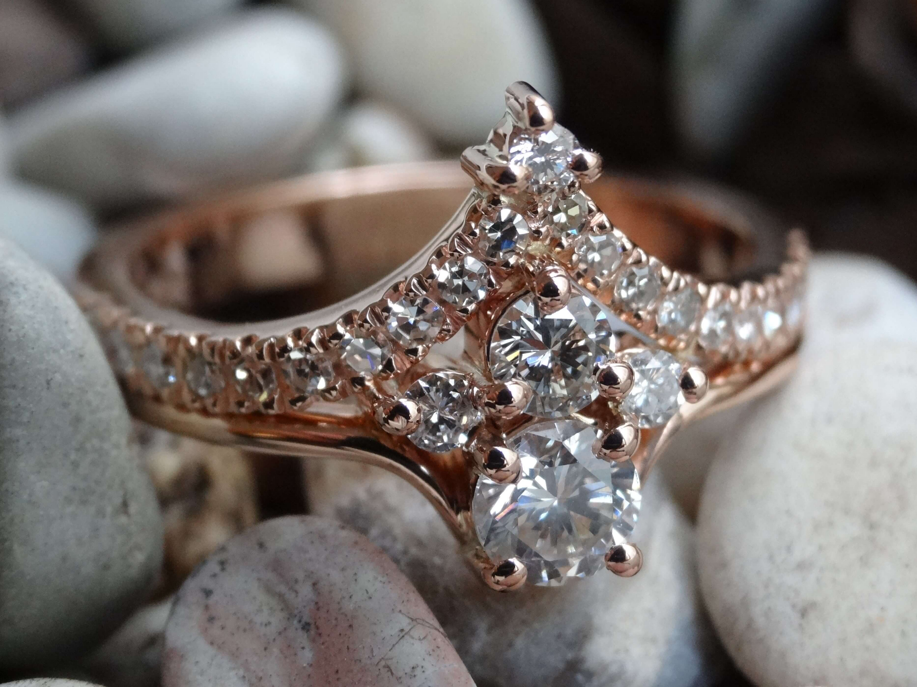 Recycled diamonds and rose gold dress ring with a cluster of five larger diamonds and micro set shoulders.